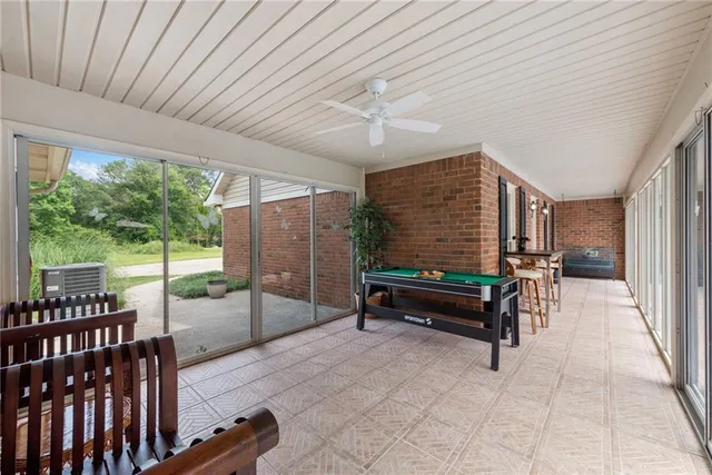 a view of grassy field with benches
