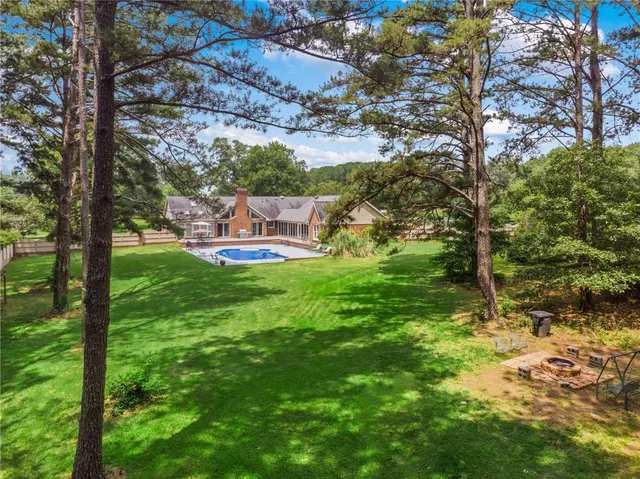 a view of a table and chairs in the garden