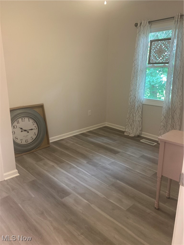 1714 Woods Road Akron, OH 44306 - Photo 13 of 28 Nice size bedroom with new LVP flooring and new ceiling fan/light fixture