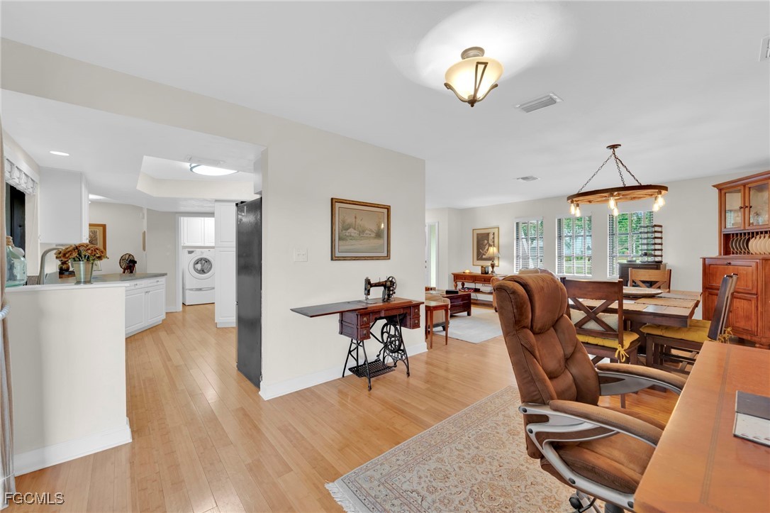 14501 Old Olga Road Fort Myers, FL 33905 - Photo 12 of 42 a living room with furniture gym equipment and large windows