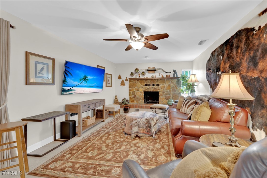 14501 Old Olga Road Fort Myers, FL 33905 - Photo 14 of 42 a living room with furniture and a flat screen tv
