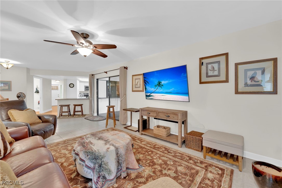 14501 Old Olga Road Fort Myers, FL 33905 - Photo 15 of 42 a living room with furniture and a flat screen tv