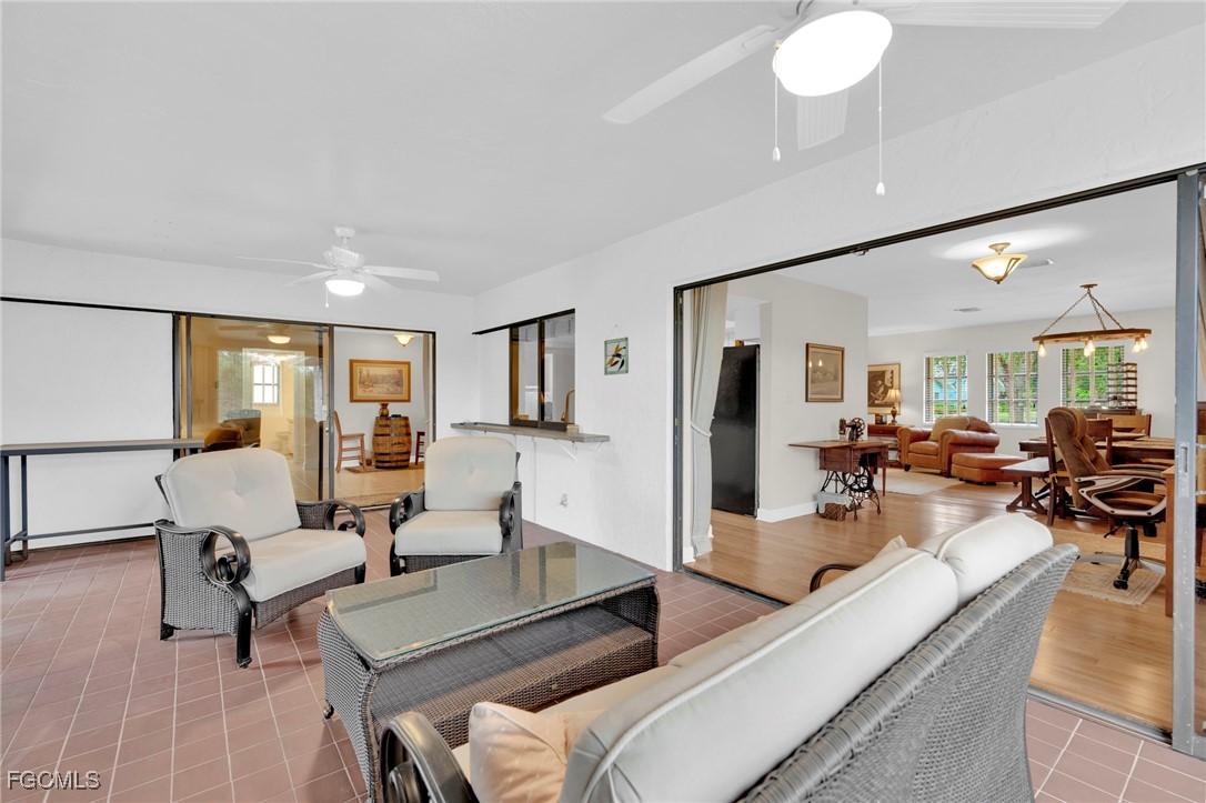 14501 Old Olga Road Fort Myers, FL 33905 - Photo 18 of 42 a living room with furniture and a table