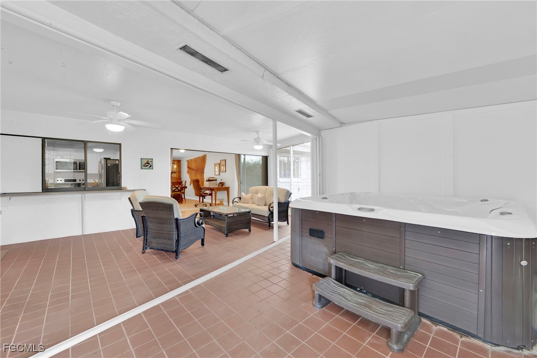 14501 Old Olga Road Fort Myers, FL 33905 - Photo 19 of 42 a living room with furniture a window and chairs