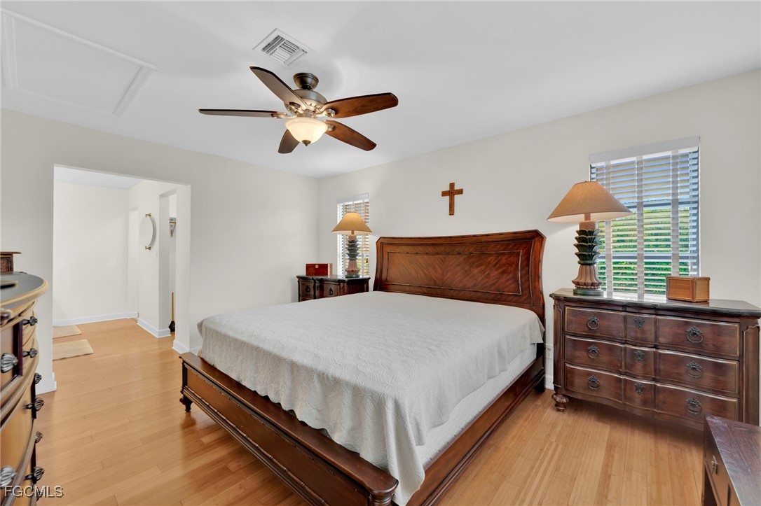 14501 Old Olga Road Fort Myers, FL 33905 - Photo 24 of 42 a bedroom with a bed and window