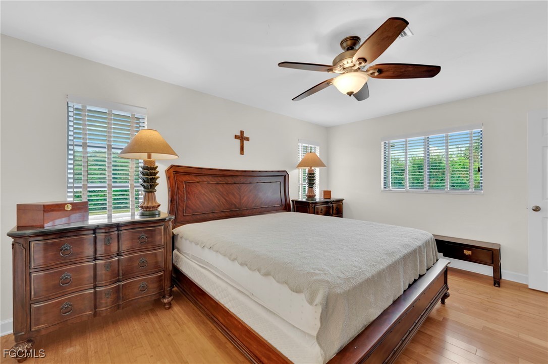 14501 Old Olga Road Fort Myers, FL 33905 - Photo 25 of 42 a bedroom with a bed and window