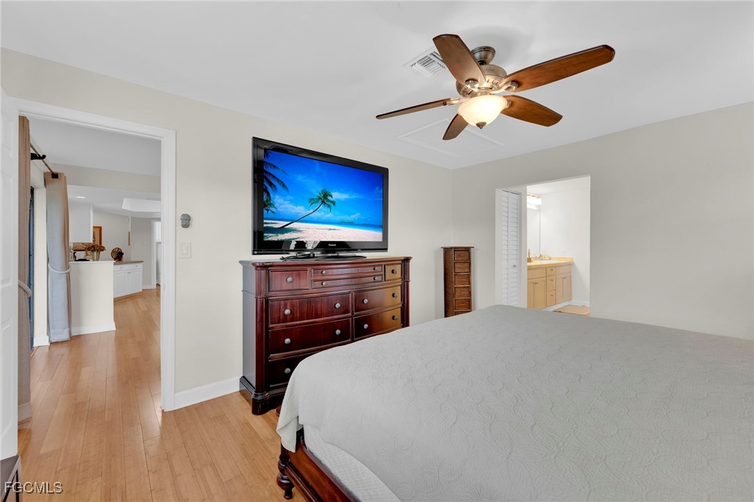 14501 Old Olga Road Fort Myers, FL 33905 - Photo 29 of 42 a bedroom with a bed and a flat screen tv