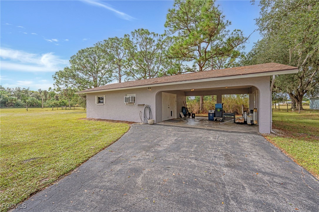 14501 Old Olga Road Fort Myers, FL 33905 - Photo 3 of 42 a view of a house with backyard and garden