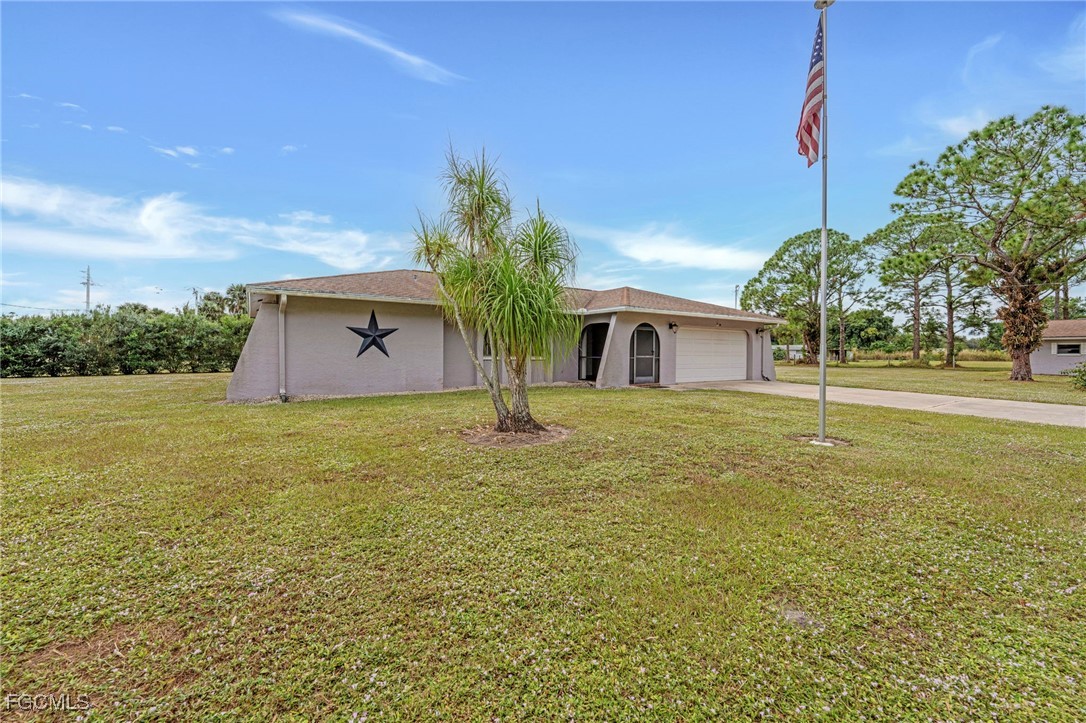 14501 Old Olga Road Fort Myers, FL 33905 - Photo 37 of 42 a house view with a garden space