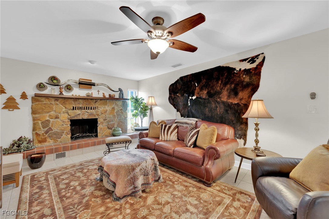 14501 Old Olga Road Fort Myers, FL 33905 - Photo 6 of 42 a living room with furniture and a fireplace