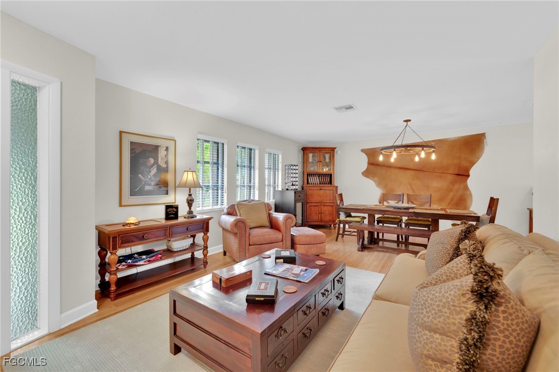 14501 Old Olga Road Fort Myers, FL 33905 - Photo 8 of 42 a living room with furniture and a flat screen tv