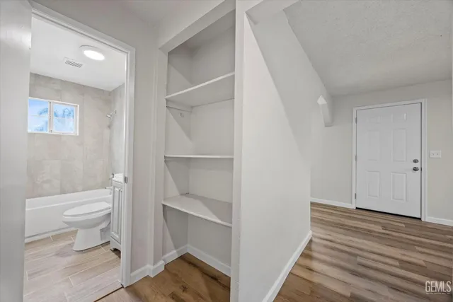 a bathroom with a toilet and a vanity