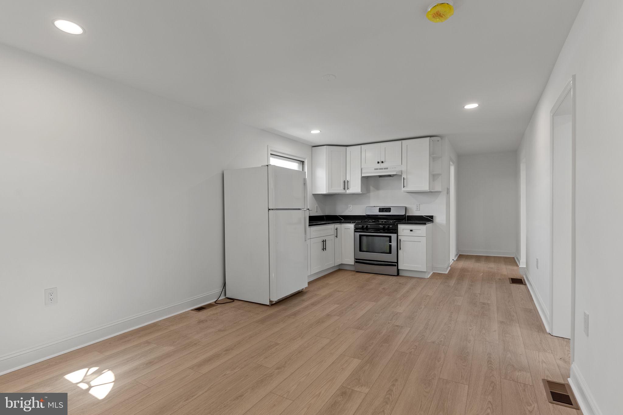 908 State Rd., Unit B Croydon, PA 19021 - Photo 3 of 9 a view of kitchen with wooden floor