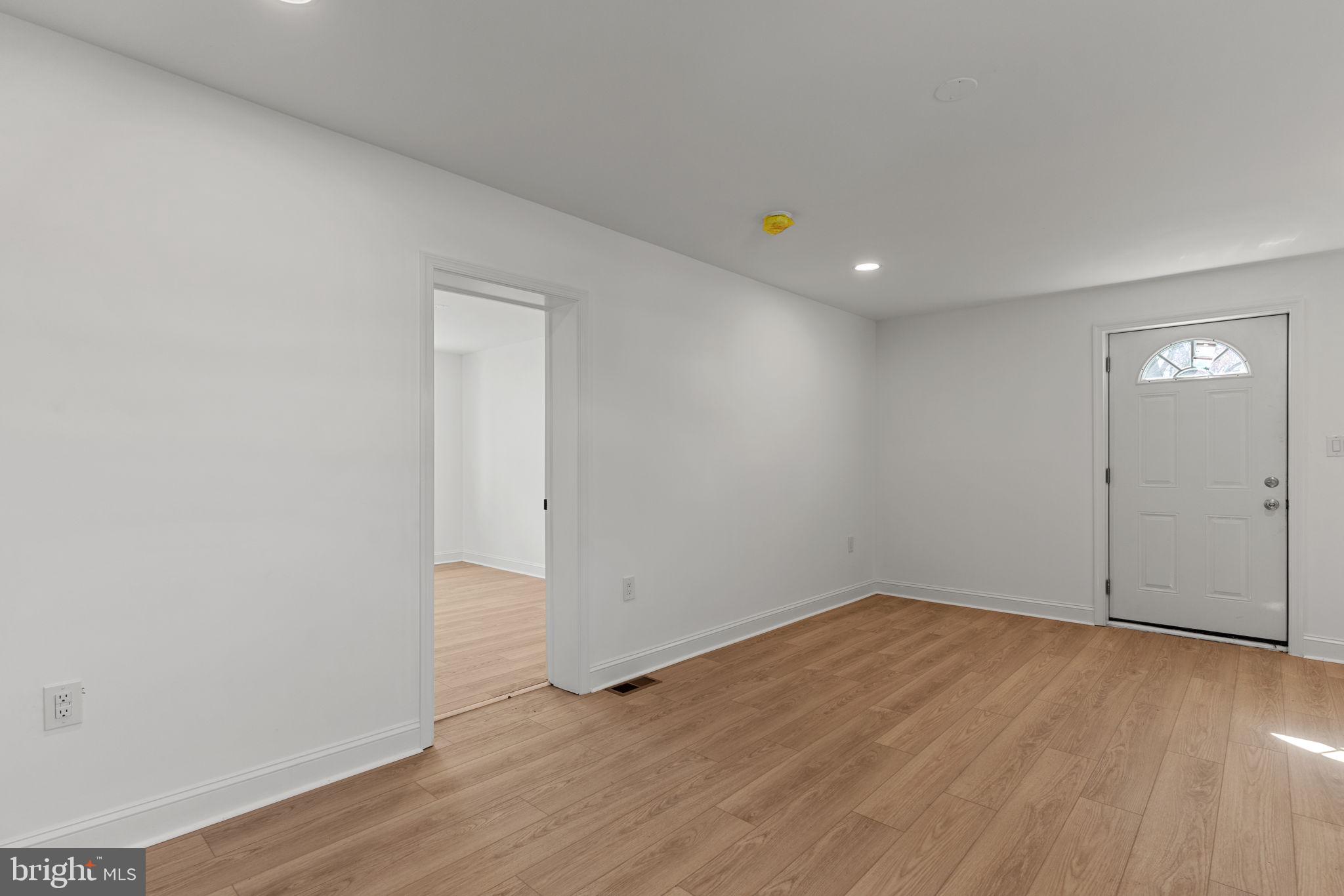 908 State Rd., Unit B Croydon, PA 19021 - Photo 4 of 9 an empty room with wooden floor and windows