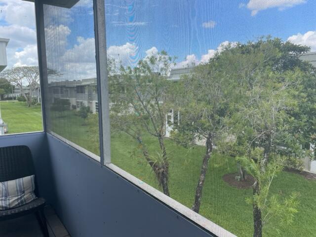 137 Flanders C Delray Beach, FL 33484 - Photo 17 of 55 a view of a glass door of the balcony
