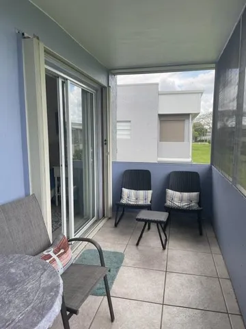 a bedroom with a bed and a mirror