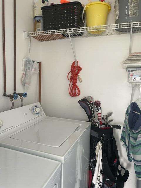 137 Flanders C Delray Beach, FL 33484 - Photo 19 of 55 a utility room with dryer and washer