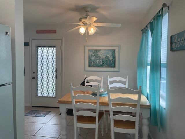 137 Flanders C Delray Beach, FL 33484 - Photo 6 of 55 a dining room with furniture and window