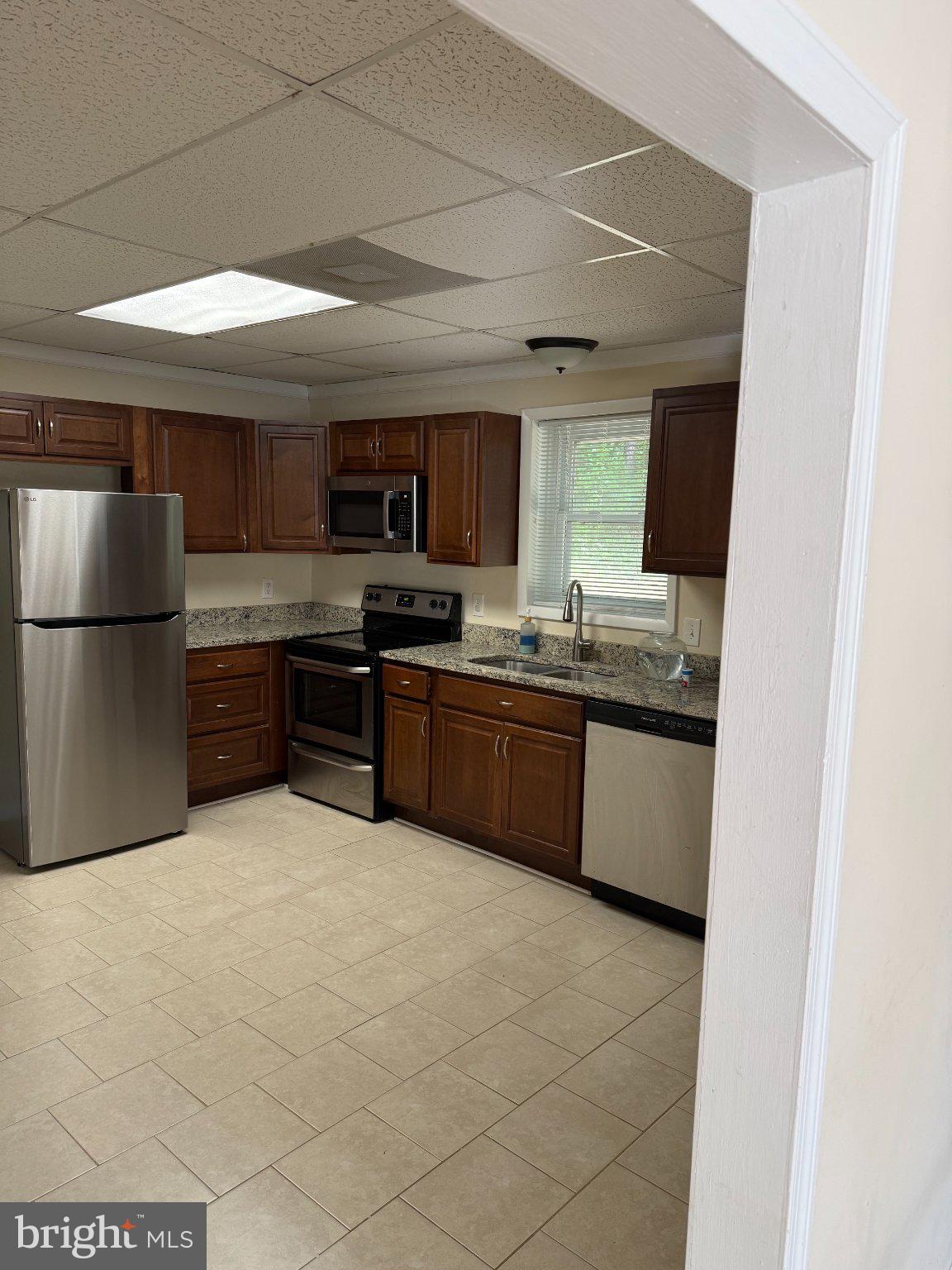 2446 Mountain View Road Stafford, VA 22556 - Photo 4 of 11 a large kitchen with a large counter top stainless steel appliances and cabinets