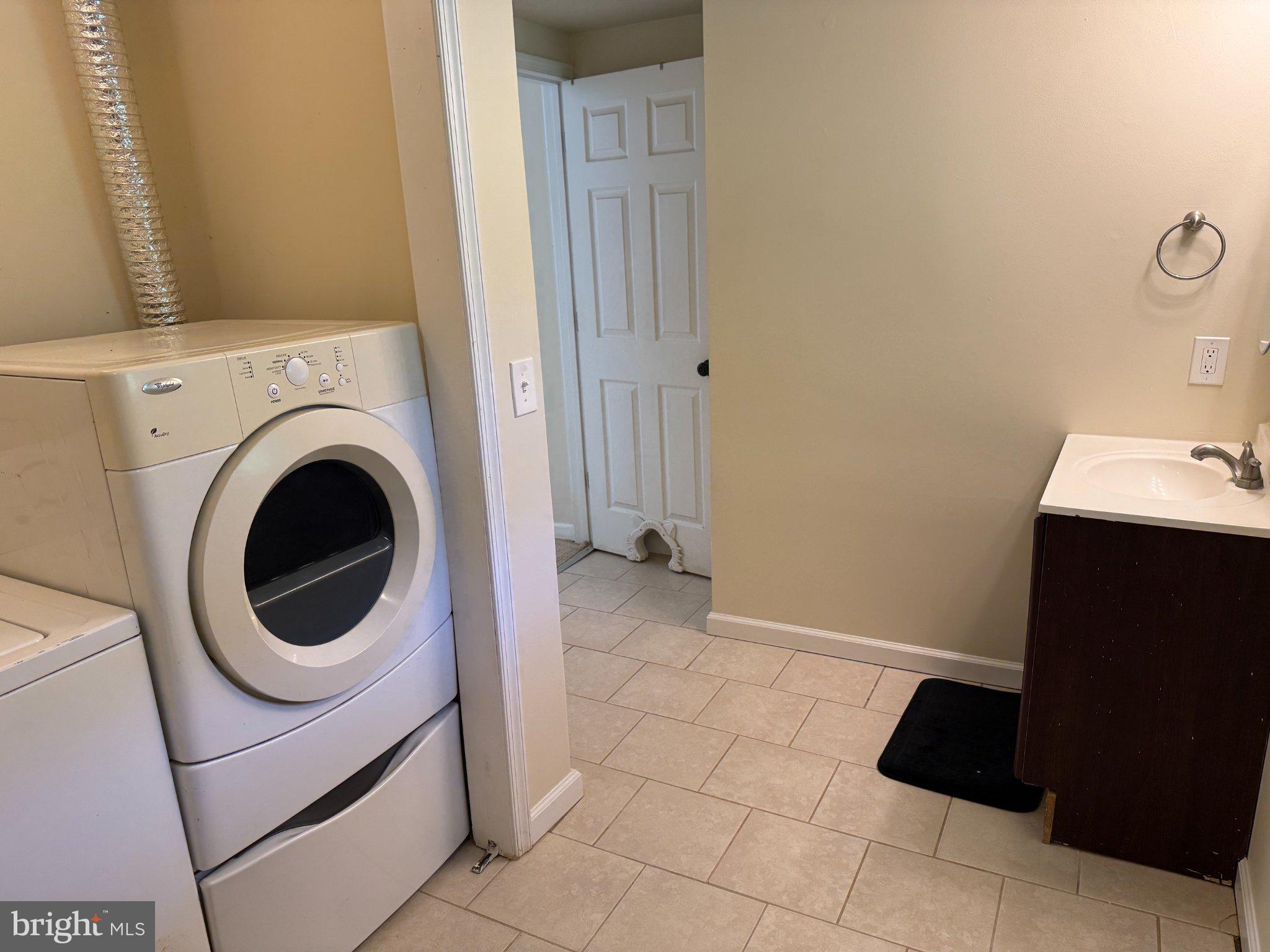 2446 Mountain View Road Stafford, VA 22556 - Photo 9 of 11 a bathroom with a sink a toilet and a mirror