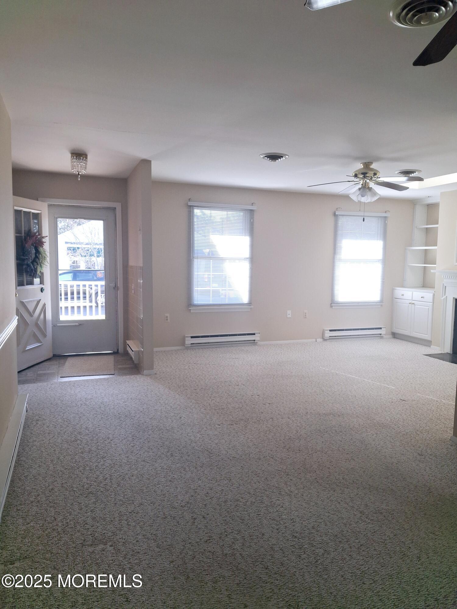 92 Sunset Road, Unit 60 Whiting, NJ 08759 - Photo 11 of 25 an empty room with windows and closet