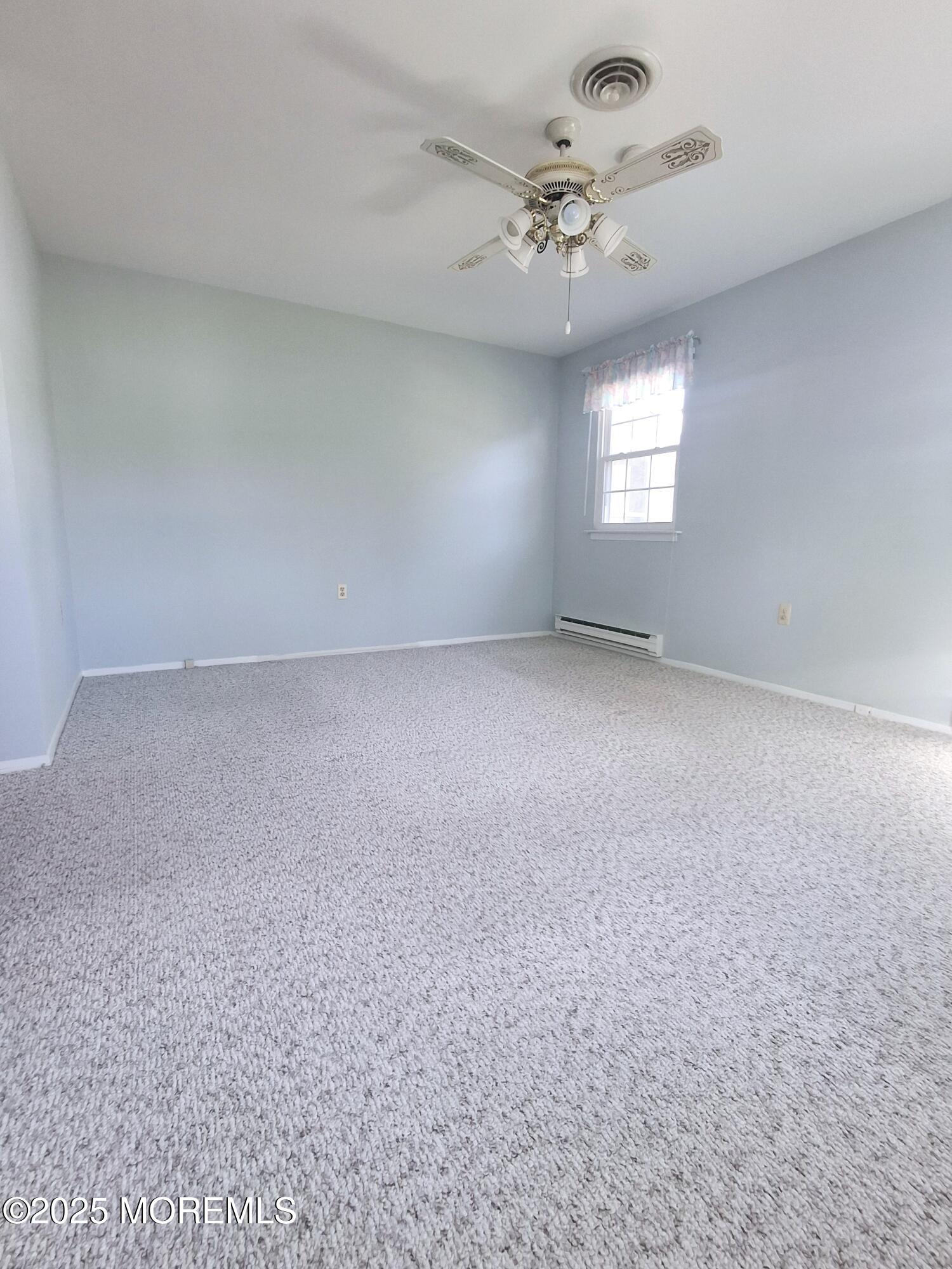92 Sunset Road, Unit 60 Whiting, NJ 08759 - Photo 13 of 25 a view of an empty room with a window