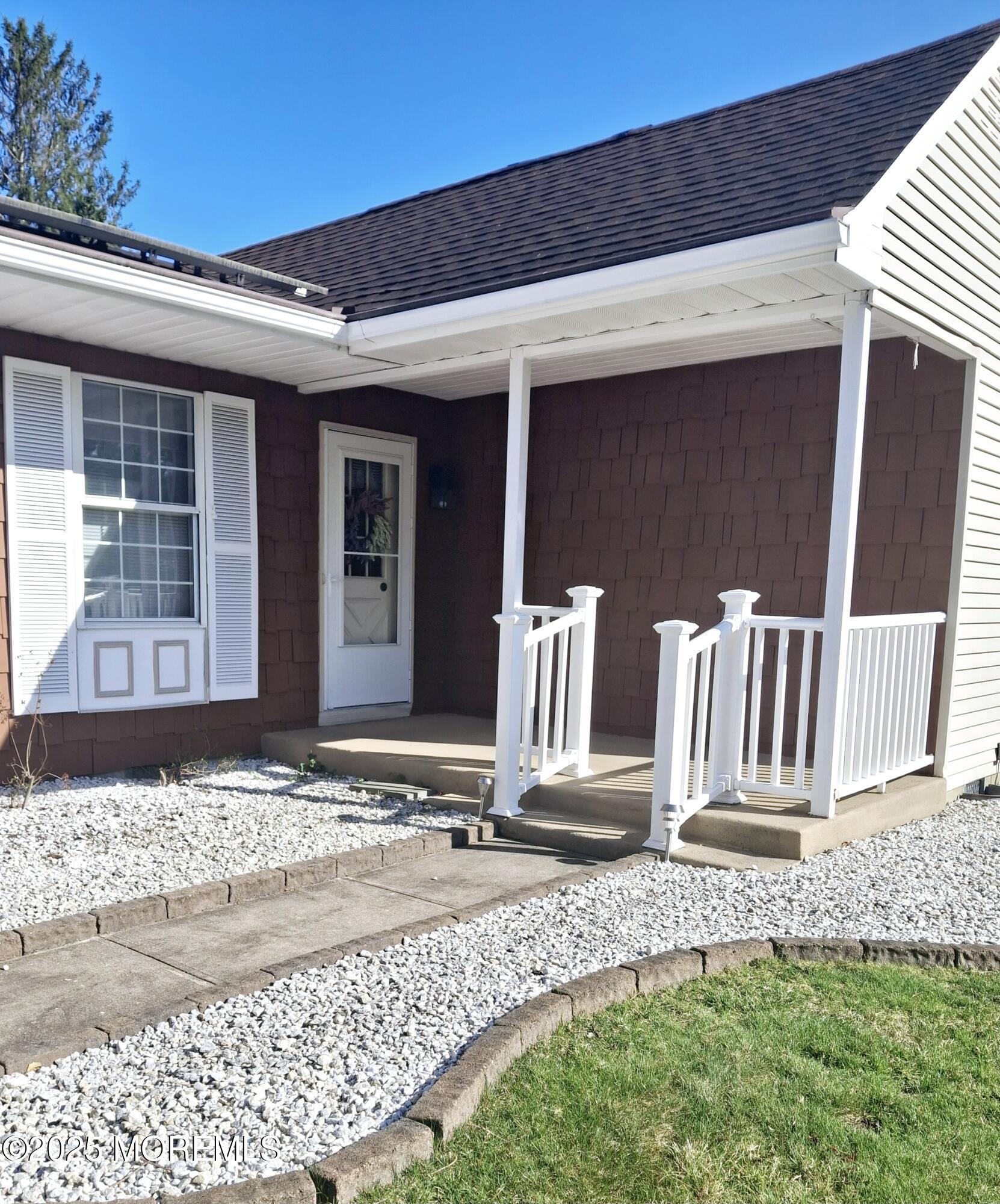 92 Sunset Road, Unit 60 Whiting, NJ 08759 - Photo 2 of 25 a front view of a house