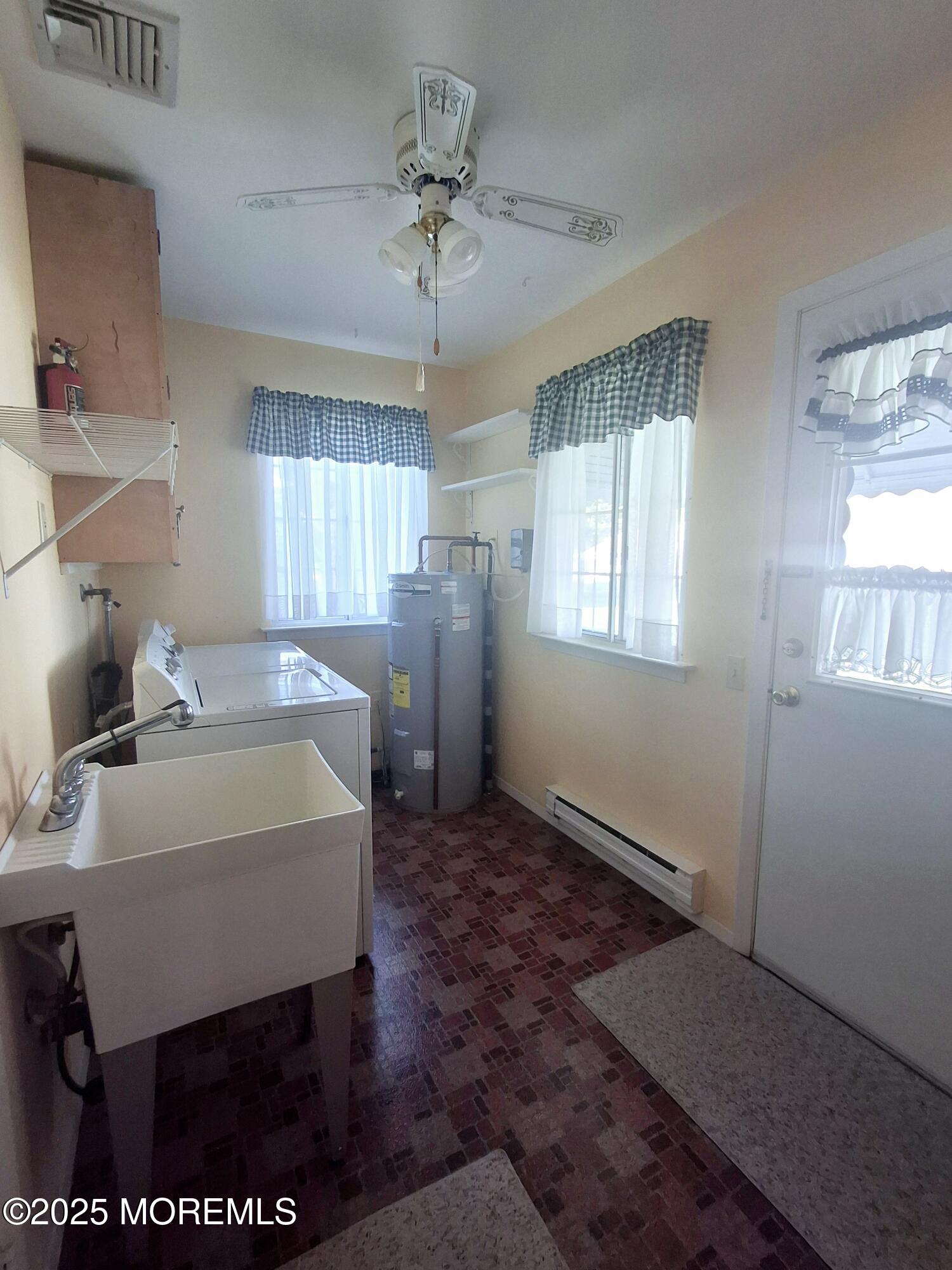 92 Sunset Road, Unit 60 Whiting, NJ 08759 - Photo 23 of 25 a spacious bedroom with a bed and a table in it