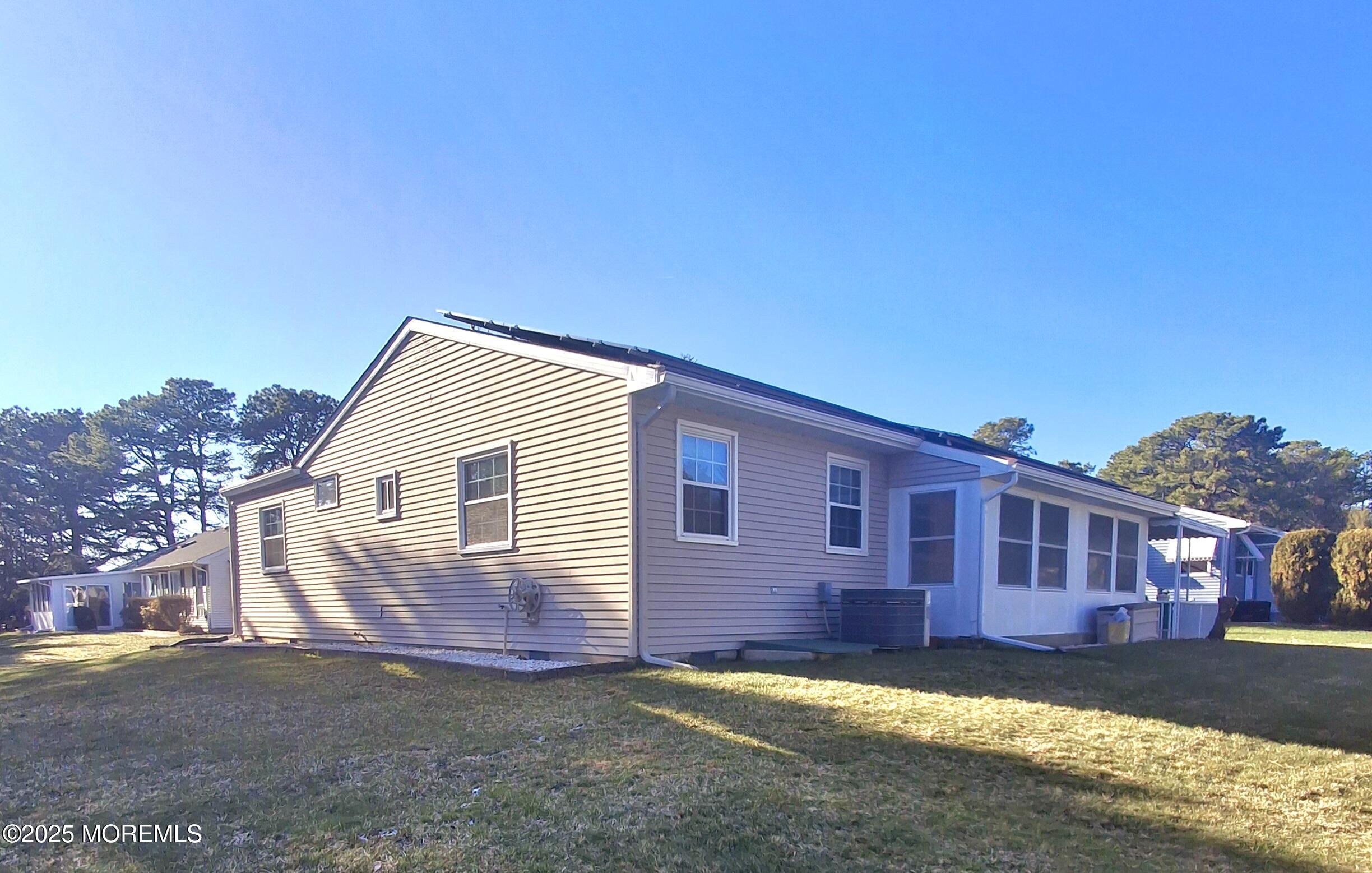 92 Sunset Road, Unit 60 Whiting, NJ 08759 - Photo 3 of 25 a view of a house with a yard