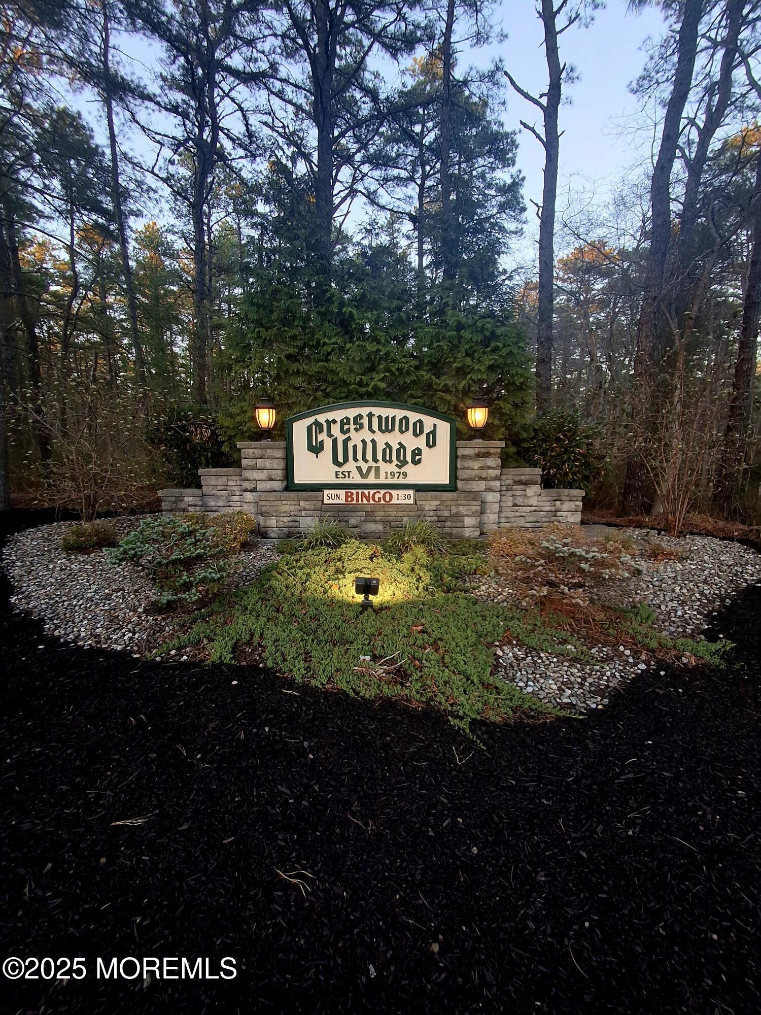 92 Sunset Road, Unit 60 Whiting, NJ 08759 - Photo 4 of 25 a sign broad in the middle of forest