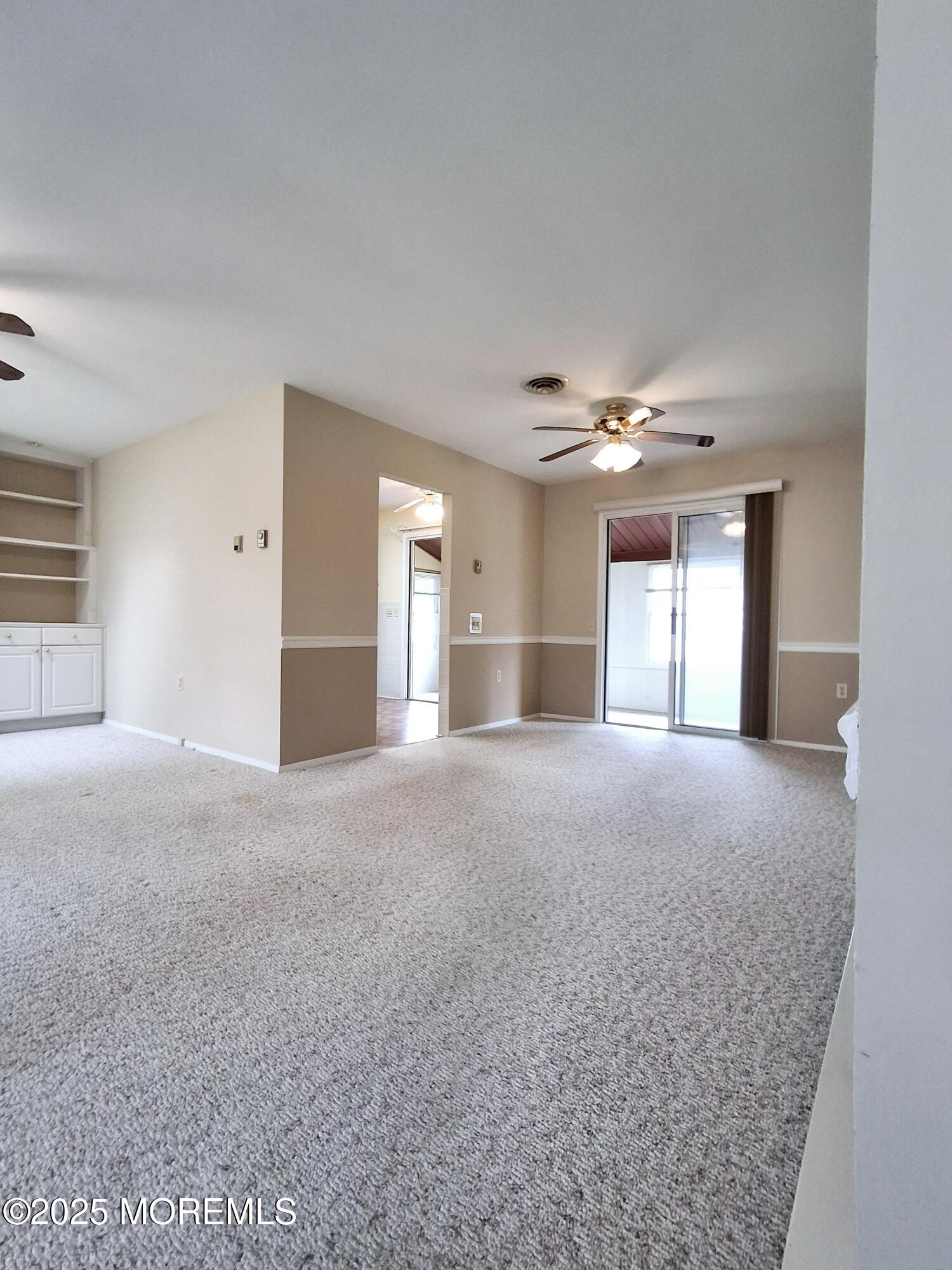 92 Sunset Road, Unit 60 Whiting, NJ 08759 - Photo 8 of 25 a view of empty room with windows and cabinet