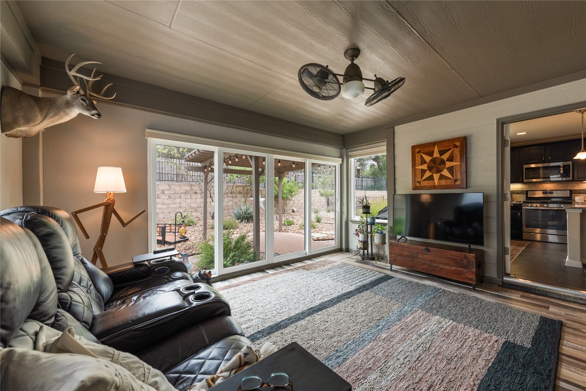 307 Hobby Street Georgetown, TX 78633 - Photo 18 of 40 a living room with furniture and a flat screen tv