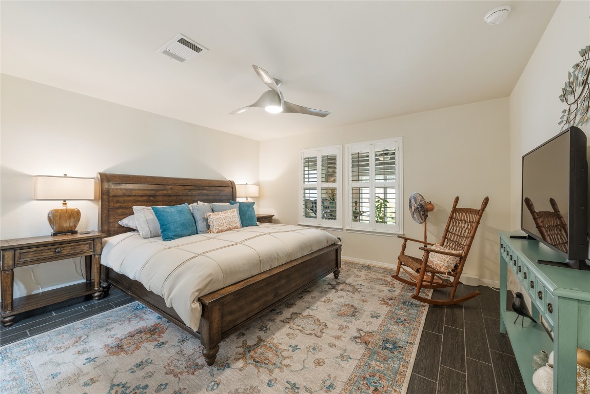 307 Hobby Street Georgetown, TX 78633 - Photo 19 of 40 a bedroom with a bed a flat screen tv and dresser