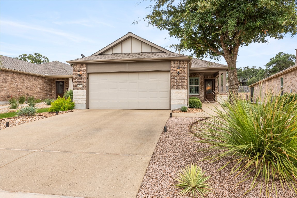 307 Hobby Street Georgetown, TX 78633 - Photo 4 of 40 a front view of a house with a yard and garage
