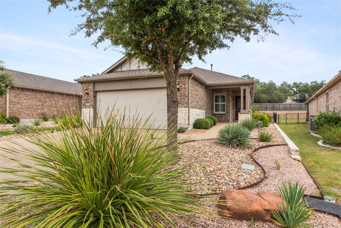 307 Hobby Street Georgetown, TX 78633 - Photo 5 of 40 a view of a house with a tree in a yard