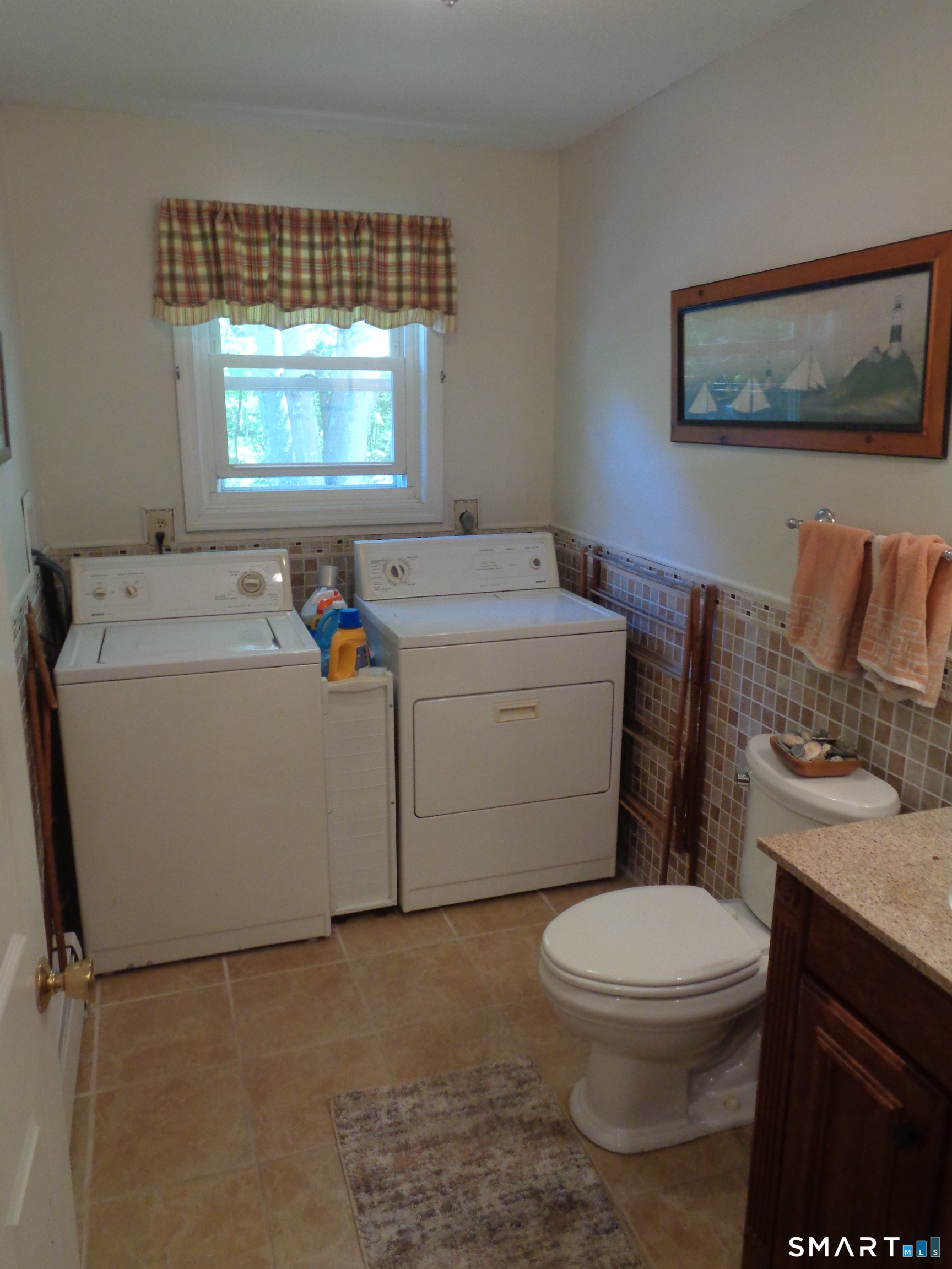 321 Spring Street Naugatuck, CT 06770 - Photo 19 of 27 a white toilet sitting next to a bathroom sink