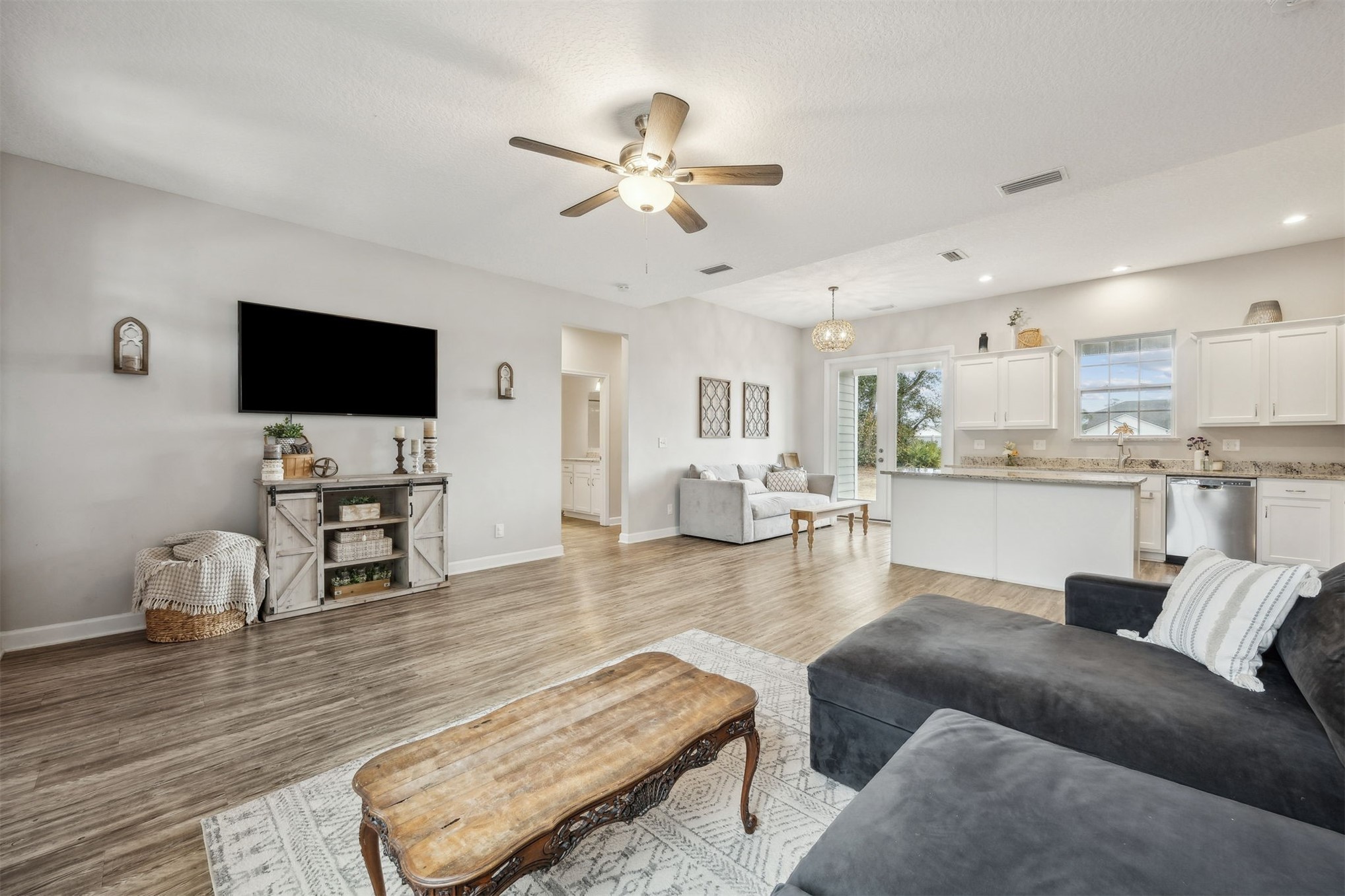 96718 Blackrock Road Yulee, FL 32097 - Photo 2 of 54 a living room with furniture and a flat screen tv