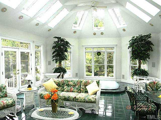 5205 Deergrass Court Raleigh, NC 27613 - Photo 5 of 25 Just off the Family Room is your Oasis. Skylights, a hot tub, and fireplace with windows galore! Sun Room
