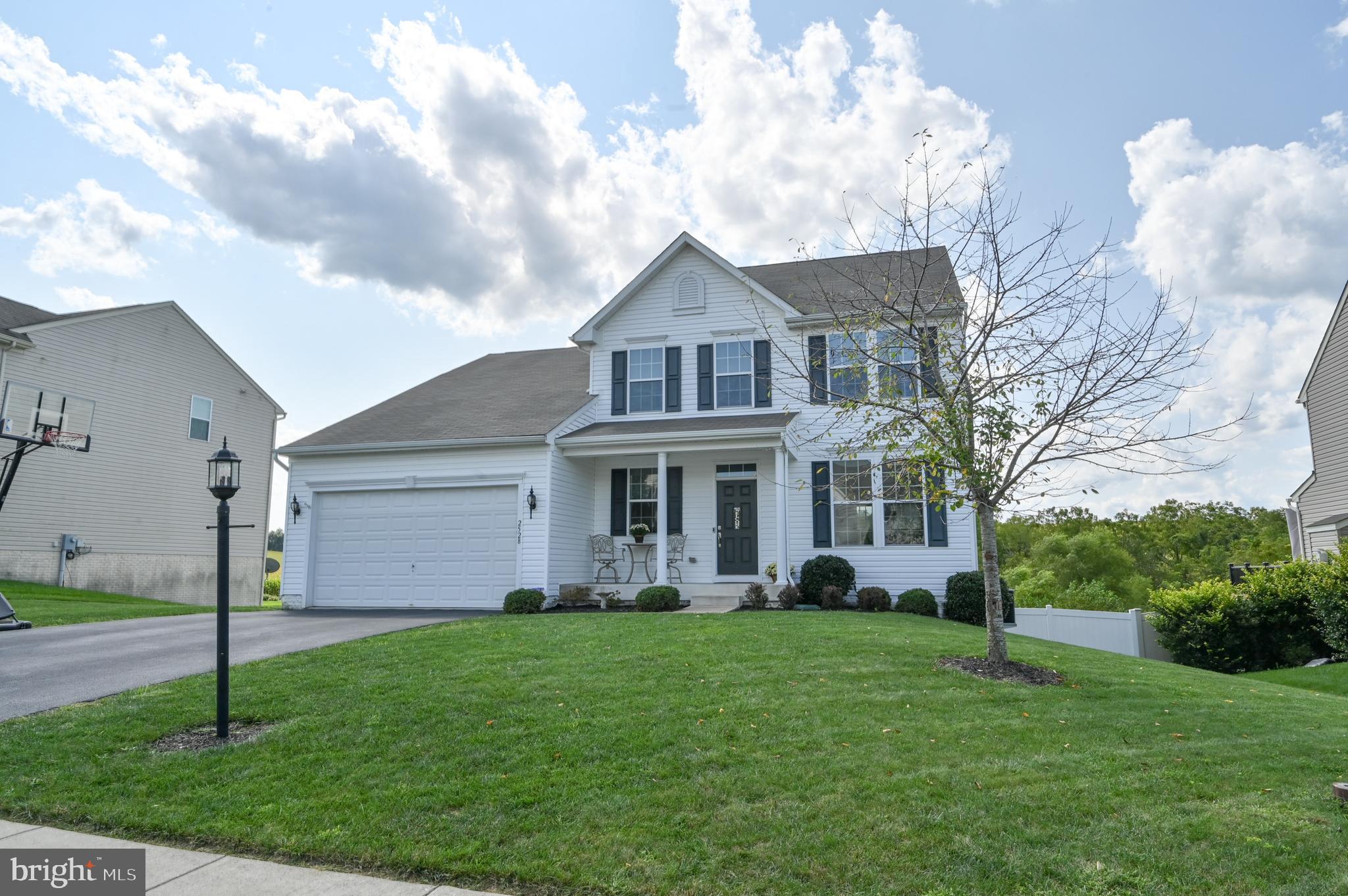2528 Codorus Lane Spring Grove, PA 17362 - Photo 3 of 77 a front view of a house with a garden and plants