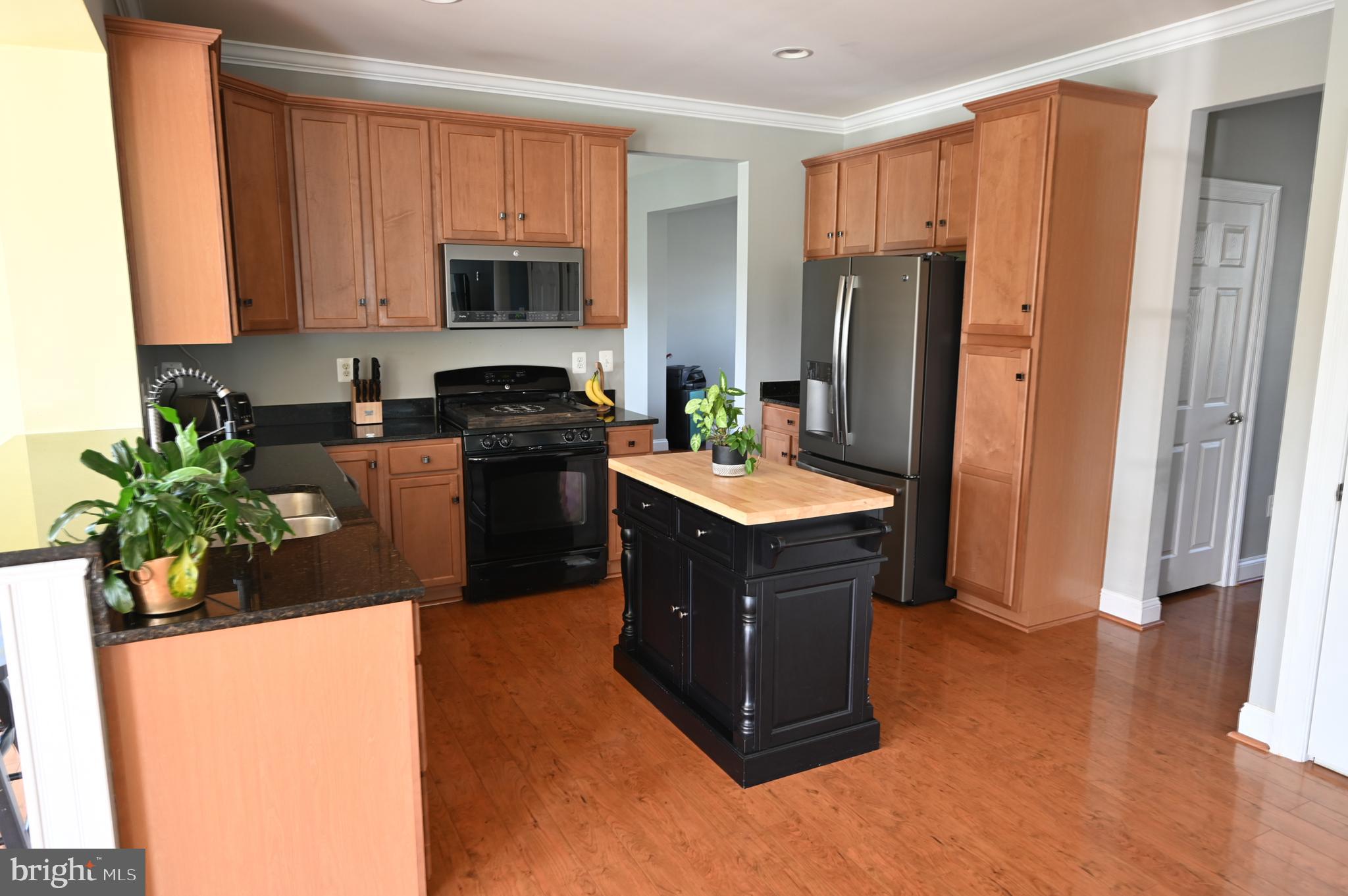 2528 Codorus Lane Spring Grove, PA 17362 - Photo 23 of 77 a kitchen with stainless steel appliances granite countertop a refrigerator a stove a sink and a microwave