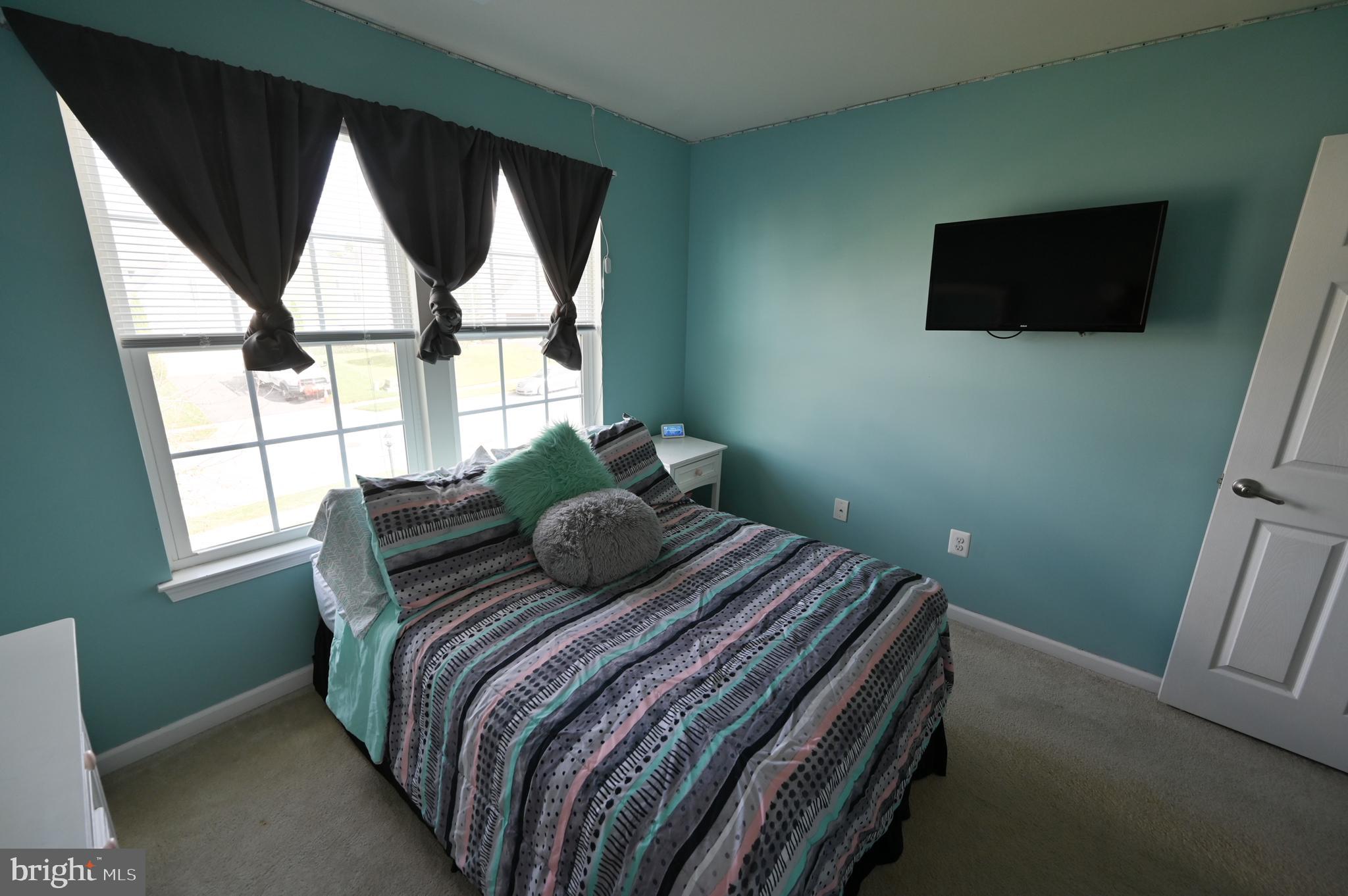 2528 Codorus Lane Spring Grove, PA 17362 - Photo 55 of 77 a bedroom with a bed window and flat screen tv