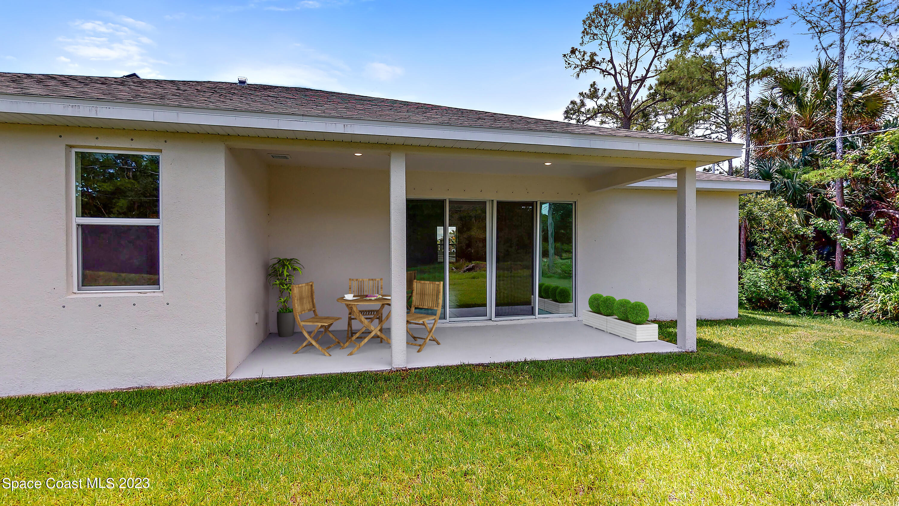467 Scarlet Road Southwest Palm Bay, FL 32908 - Photo 15 of 18 016.1_virtual staged lanai