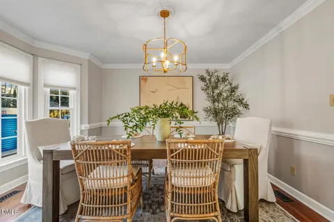 a kitchen with stainless steel appliances granite countertop a stove a sink dishwasher and a refrigerator with wooden floor