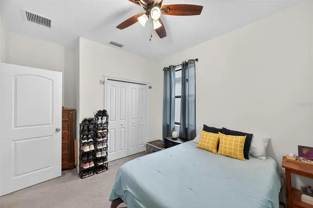 a bathroom with a sink a toilet and shower curtain