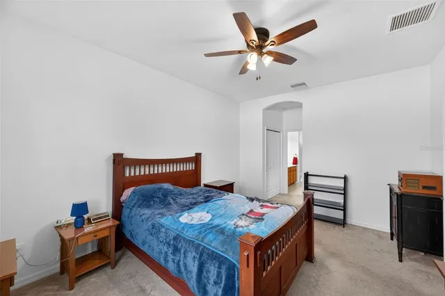 a bathroom with a sink vanity tub and toilet