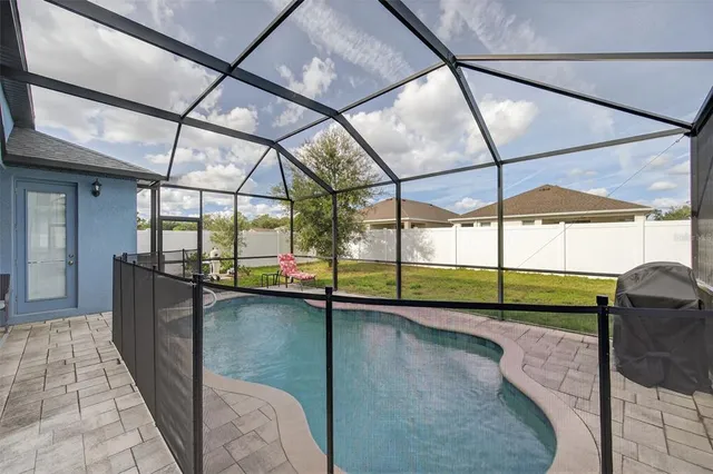 an aerial view of a residential building and lake view