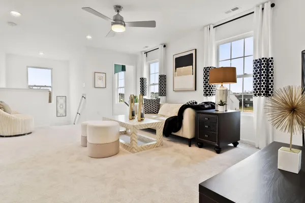a living room with furniture and a lamp