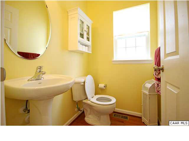 708 Rainier Road Charlottesville, VA 22903 - Photo 13 of 29 a bathroom with a sink mirror and toilet