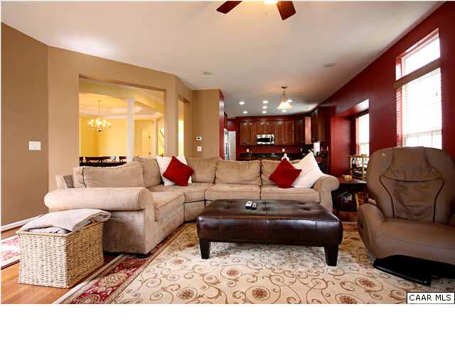 708 Rainier Road Charlottesville, VA 22903 - Photo 3 of 29 a living room with furniture gym equipment and a large window