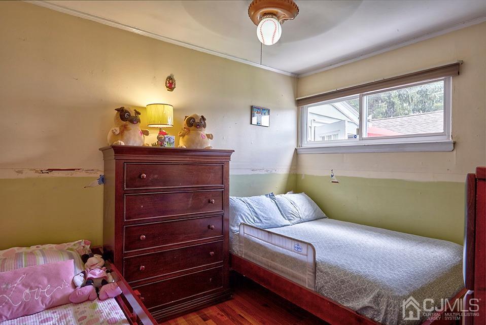 10 Pennington Road New Brunswick, NJ 08901 - Photo 16 of 29 a bedroom with a bed and window